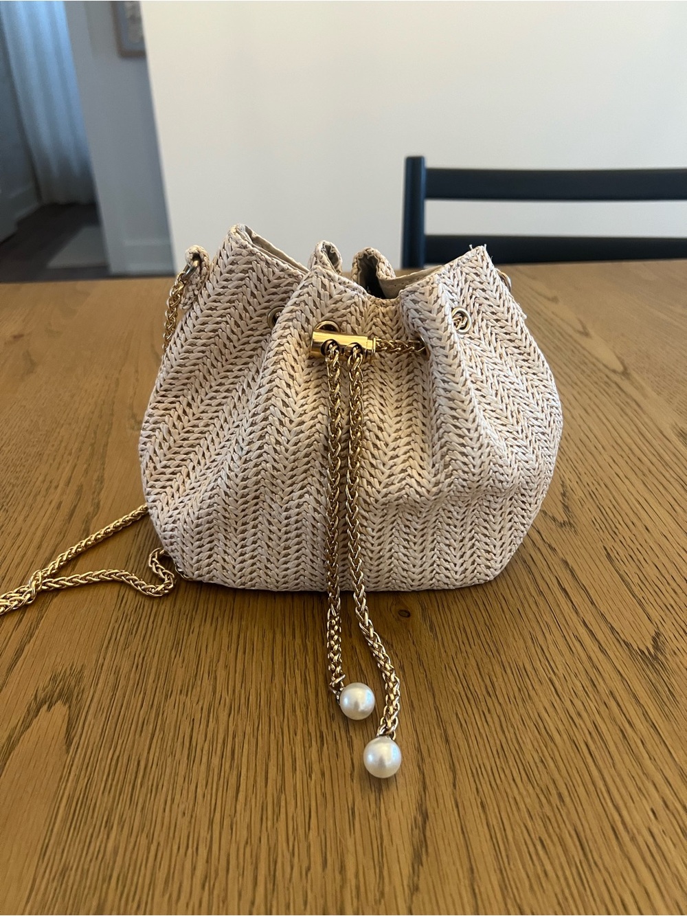 Woven Pearl-Accent Drawstring Crossbody Bag in Beige